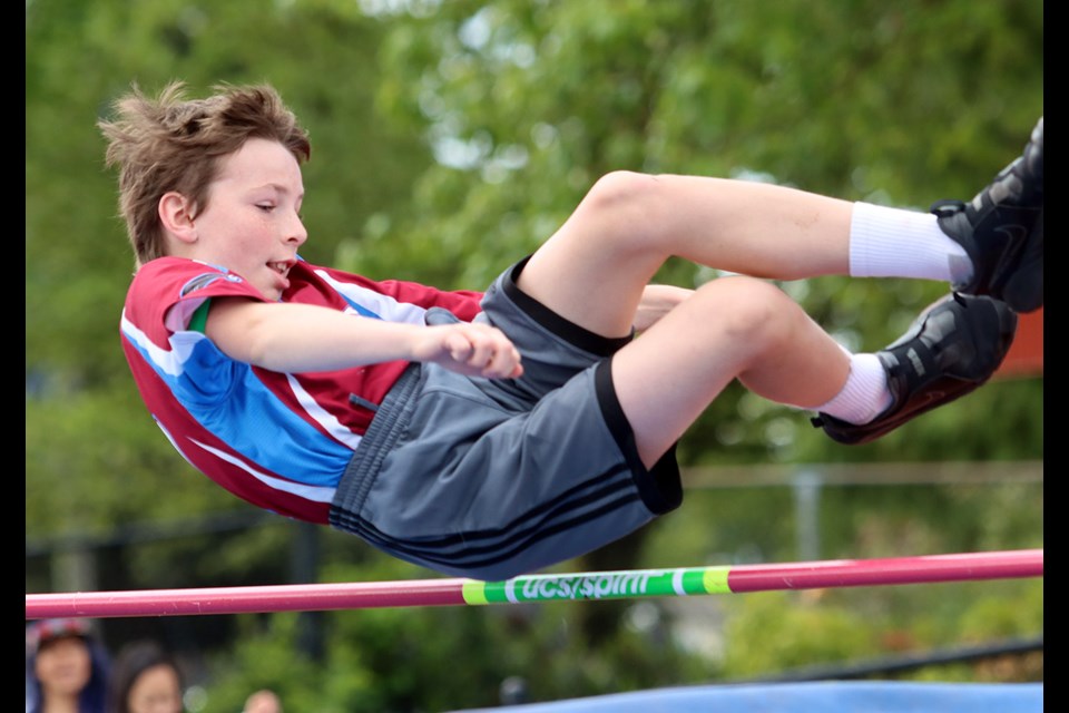 Ben Bird, of Porter Elementary School, clears the bar in the Grade 4 boys high jump competition, Wednesday at the SD43 elementary schools track and field meet at Coquitlam's Percy Perry Stadium.