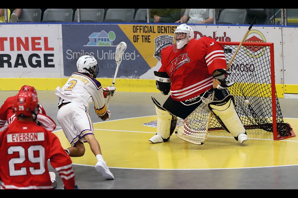 Coquitlam Adanacs forward Cody Malawsky opens the scoring on Okotoks Raiders goalie Tommy Wood in the first period of their opening round gamea the 2024 Minto Cup national junior lacrosse championship, Saturday at the Poirier Sport and Leisure Complex.