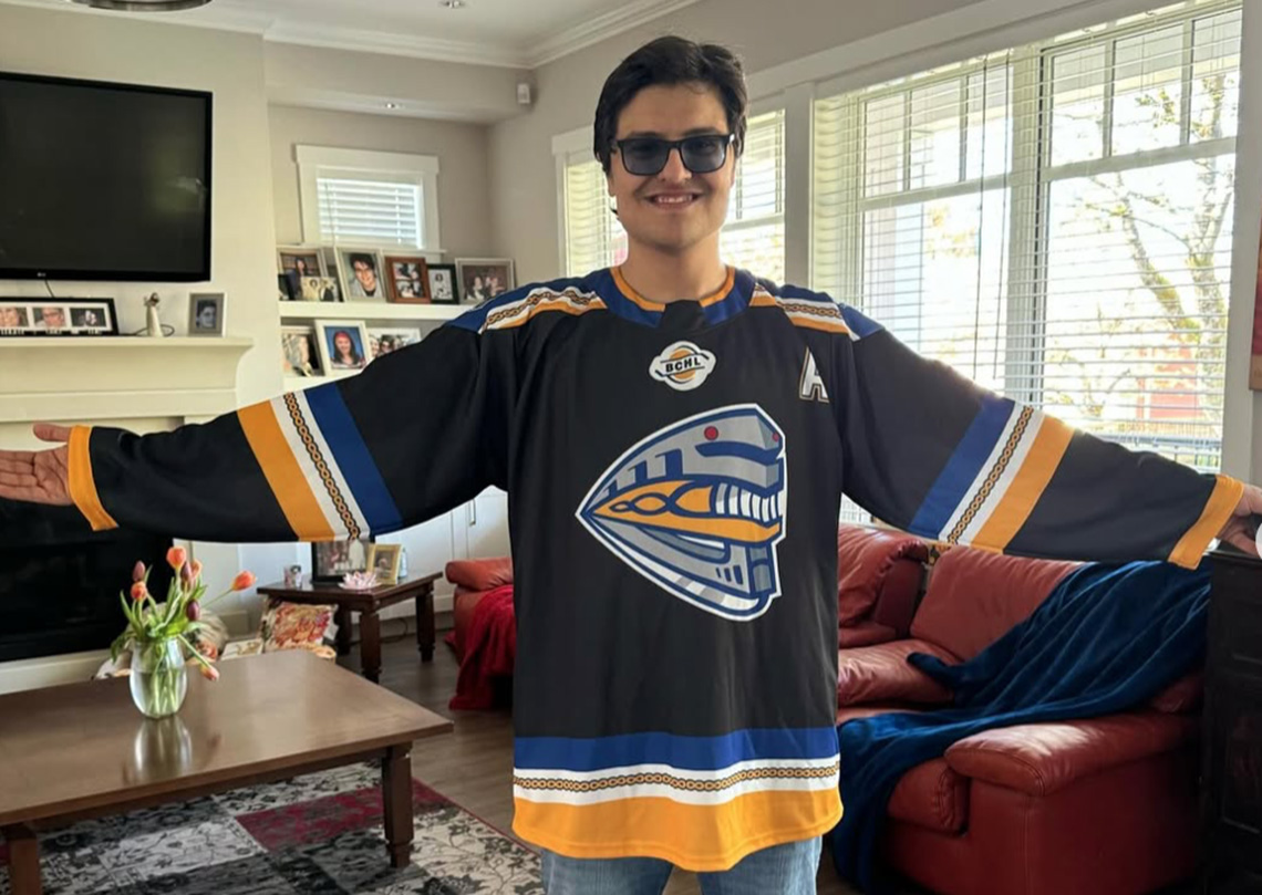 Lucas Gates shows off first jersey he designed for Coquitlam Express autism acceptance game in 2024