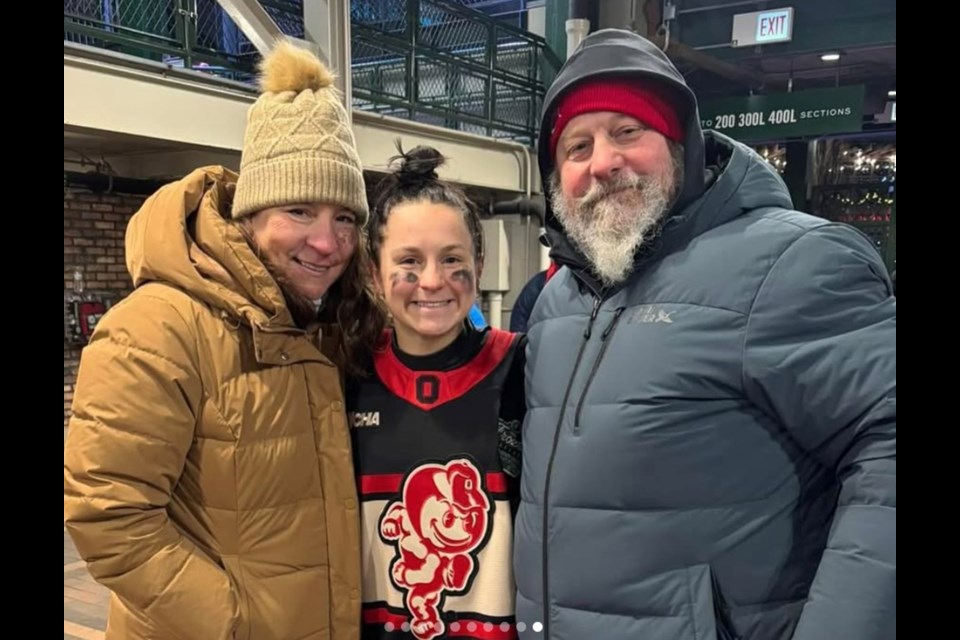 Port Moody's Jenna Buglioni with her parents at a special outdoor game between her Ohio State Buckeyes women's hockey team and the Wisconsin Badgers that was played at Wrigley Field in Chicago on Jan. 4.