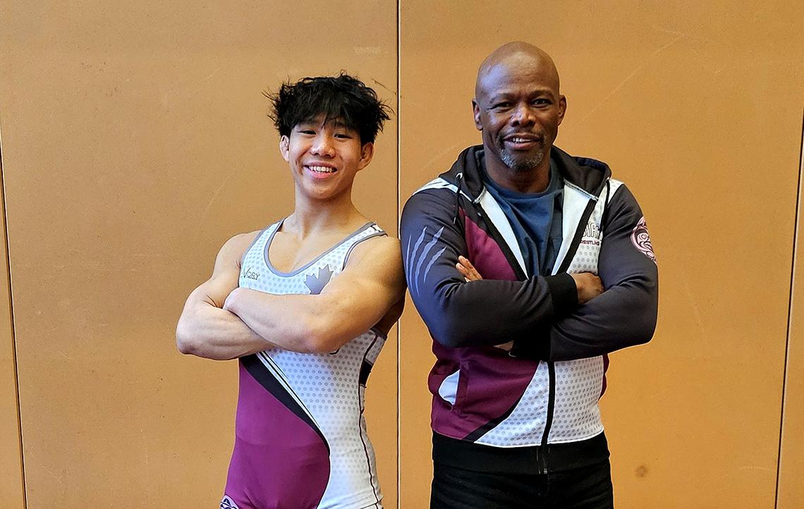 Heritage Woods Kodiaks wrestler Markus Lee and his coach, Rick Dove.