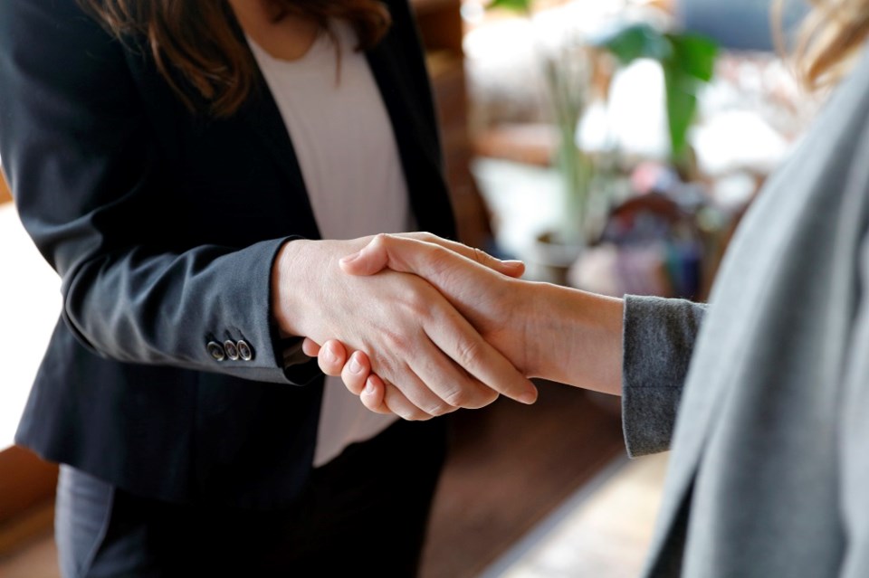 women-shaking-hands-getty-images