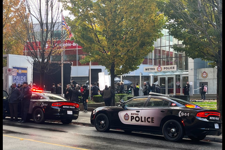 Police cars and fire trucks are out front of the CBC office in downtown Vancouver, Oct. 28, 2024.