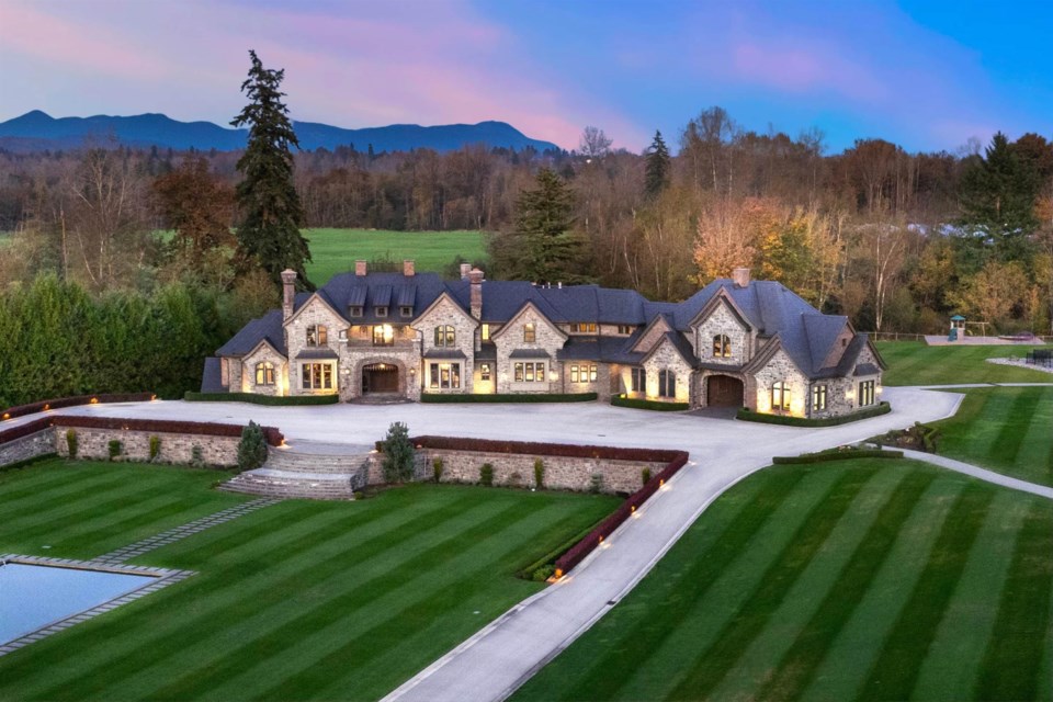 The massive house at 6124 272 St in Langley, B.C. is on the market for $27.8 million after more than $7 million has been shaved off the asking price.