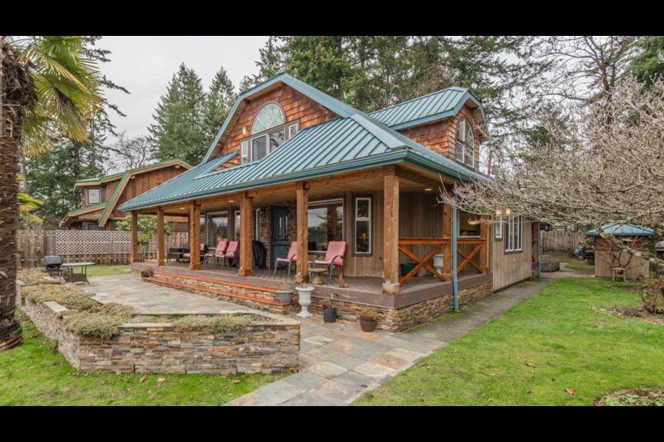 This unassuming house for sale near Nanaimo, B.C. comes with a ferry and a pub.