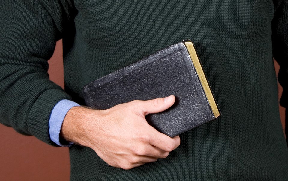 man-holding-bible