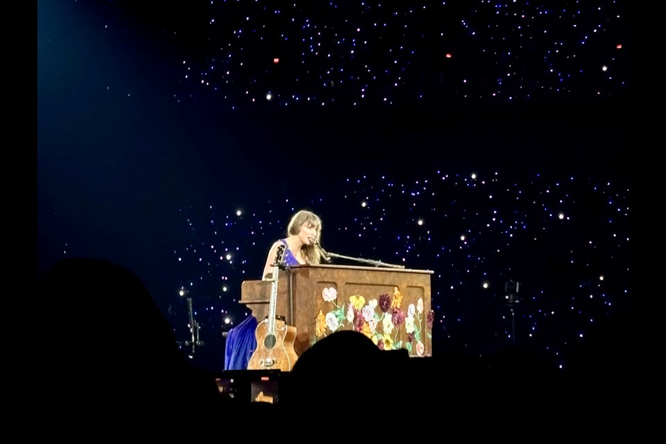 Taylor Swift plays the piano during the acoustic portion of her epic 3.5-hour Eras Tour show on Dec. 6, 2024, in Vancouver.