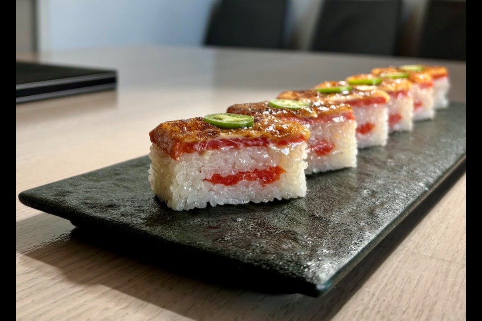 Salmon aburi oshi sushi - torched and pressed B.C. sockeye salmon sushi - is Miku's signature dish. Launched in 2008, the restaurant is set to mark its one millionth order of the iconic dish.