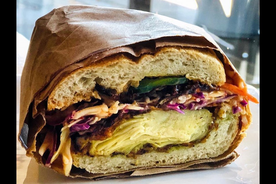 The Arbor on Vancouver's Main Street is known for its vibrant vegetarian comfort eats, like its signature Southern Fried Artichoke Sandwich. The restaurant will close its doors in April 2024 after 7.5 years.