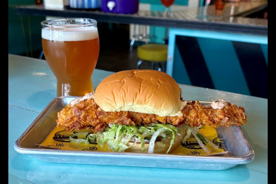 Kapow!, a Vancouver food truck with smashburgers and tots, has put a massive fried fish burger on the menu for summer 2024.