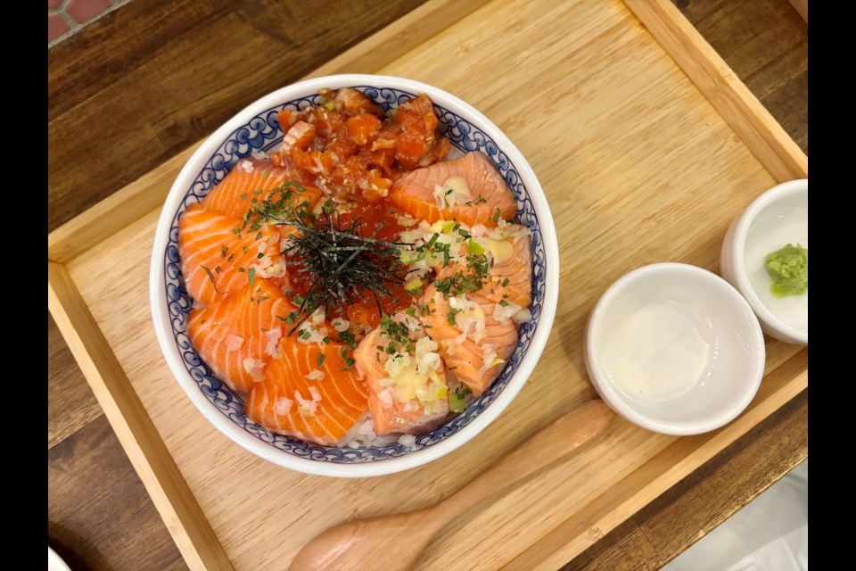 Sushi rice bowls, like one featuring three preparations of salmon with ikura, are the focal point at Toyokan Bowl, a retro-infused bowling-themed Japanese restaurant in Vancouver