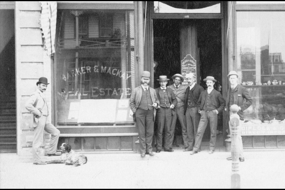 In this photo from 1889, Bruce (the dog) with his human E.E. Barker (no joke) hang out at Barker's real estate office; Barker and Bruce are the two on the left.
Reference code: AM54-S4-: Str P50