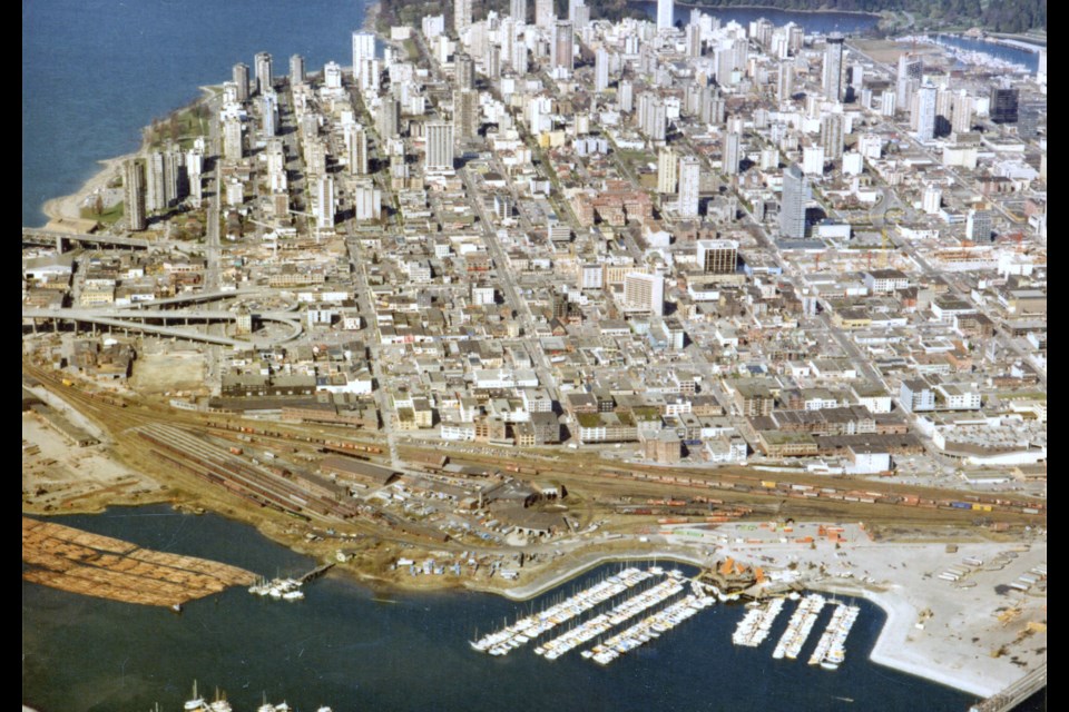 Part of False Creek's industrial area in the 1970s, with the (recently destroyed) Granville Bridge loops on the left. The roundhouse (now a community centre) is visible at the bottom. The area pictured is now home to many residential towers, David Lam Park, and more.
Reference code: COV-S167---: CVA 515-9