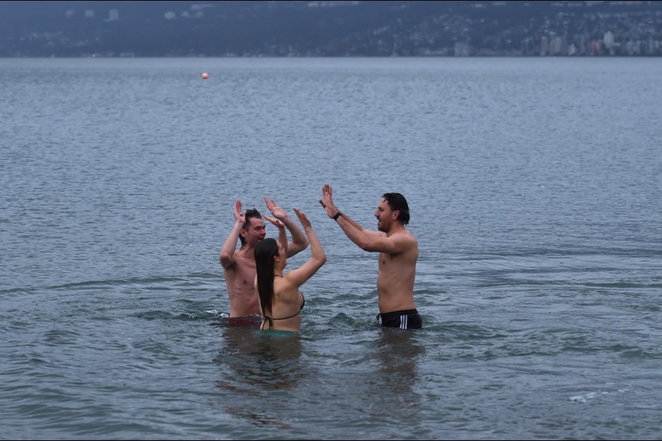 The trio are taking daily plunges at beaches around Vancouver through February.