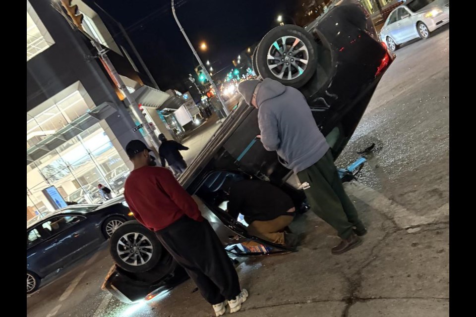 Michel Roman works as a budtender at the ARCannabis Store in Kitsilano in Vancouver and heard a collision that caused an Evo Car Share to flip on its roof.