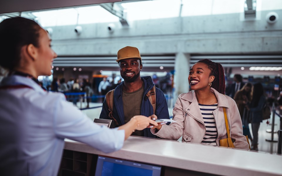 people-checking-in-flight-couple