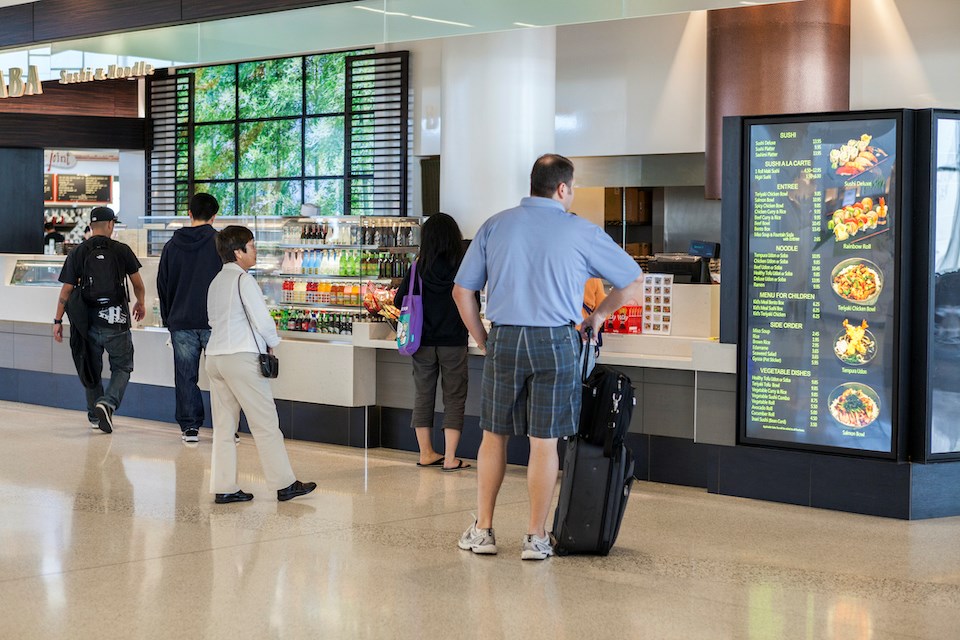 people-picking-food-airport