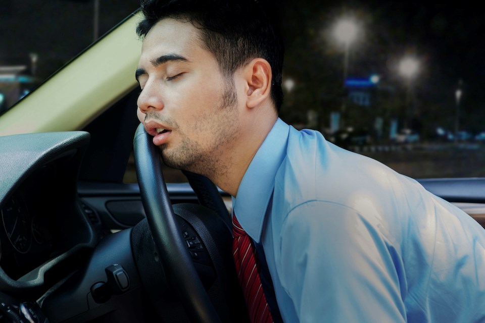 person-sleeping-in-car