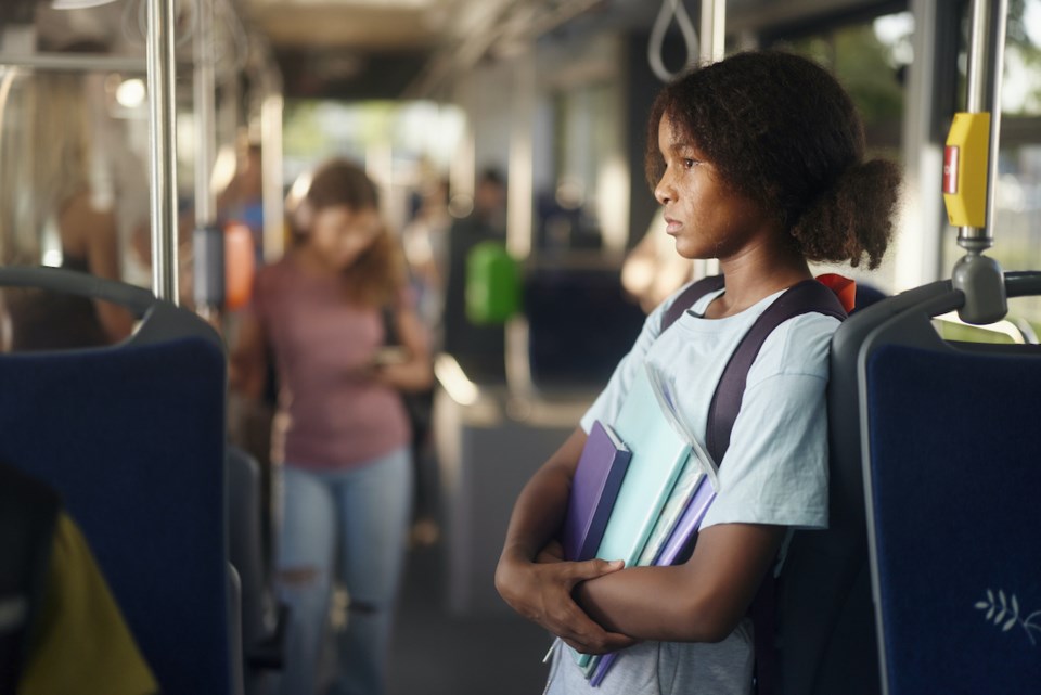 teen-youth-riding-public-transit-bus