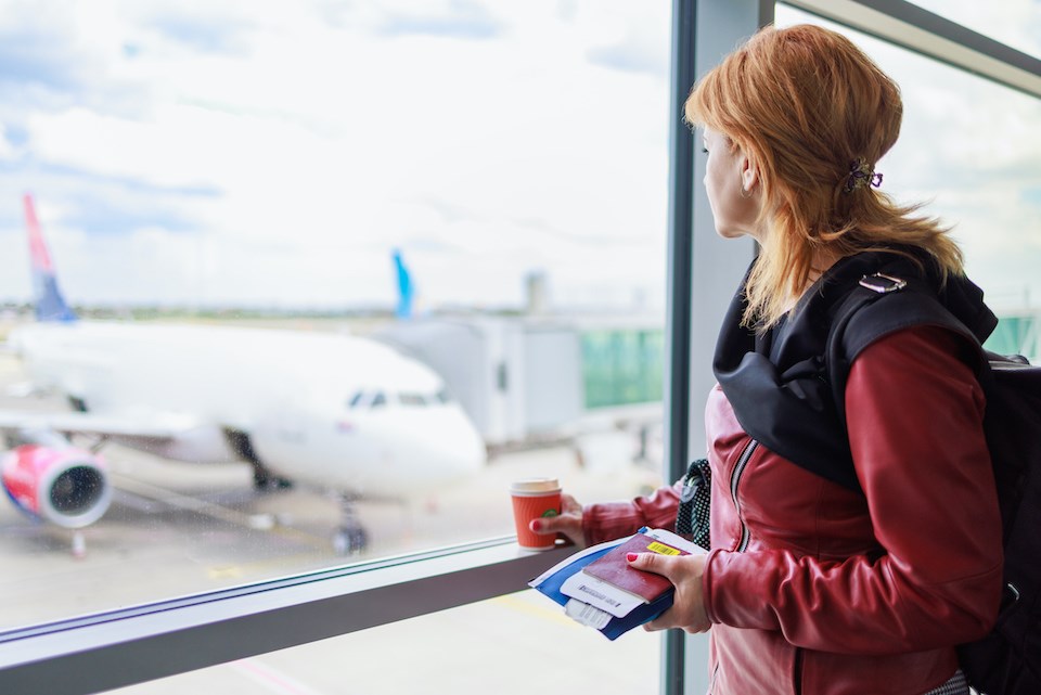 woman-looking-at-plane-november-2024