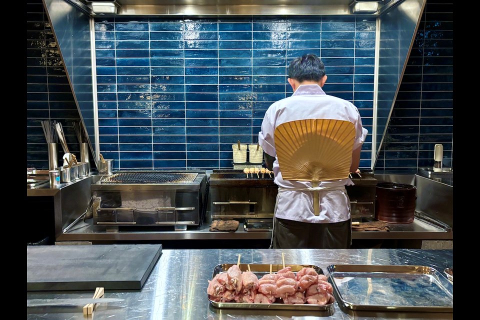 Chef Pete Ho tends to the charcoal grill at his new Vancouver restaurant Sumibiyaki Arashi, which serves an omakase yakitori (grilled chicken skewer) dinner