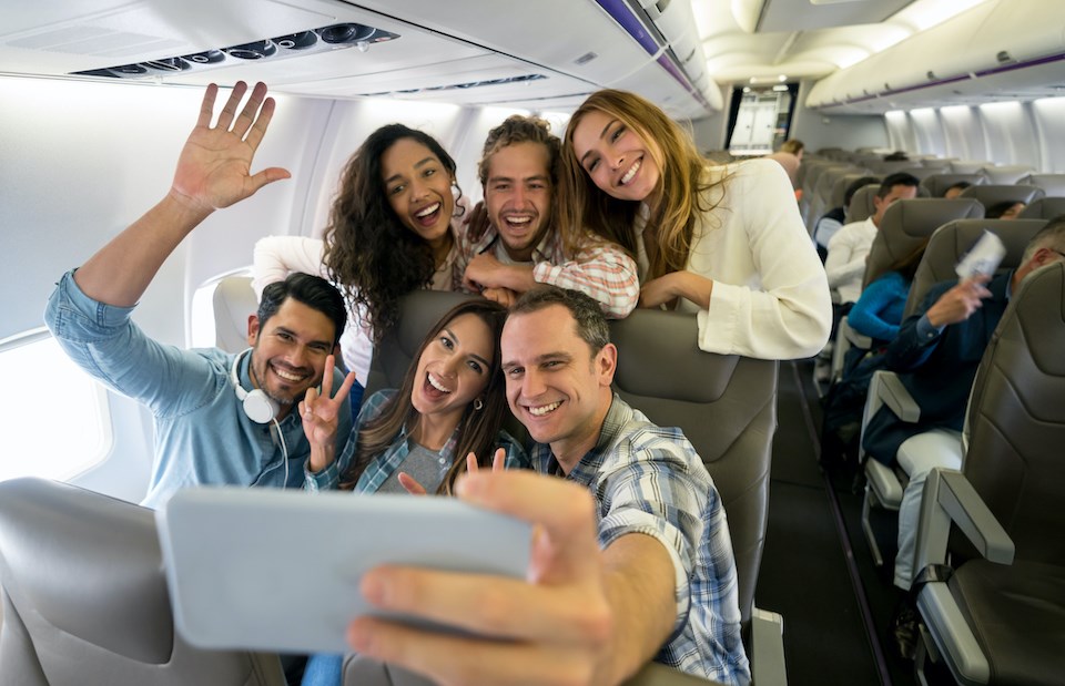 people-happy-plane-vancouver-flights-westjet-2025