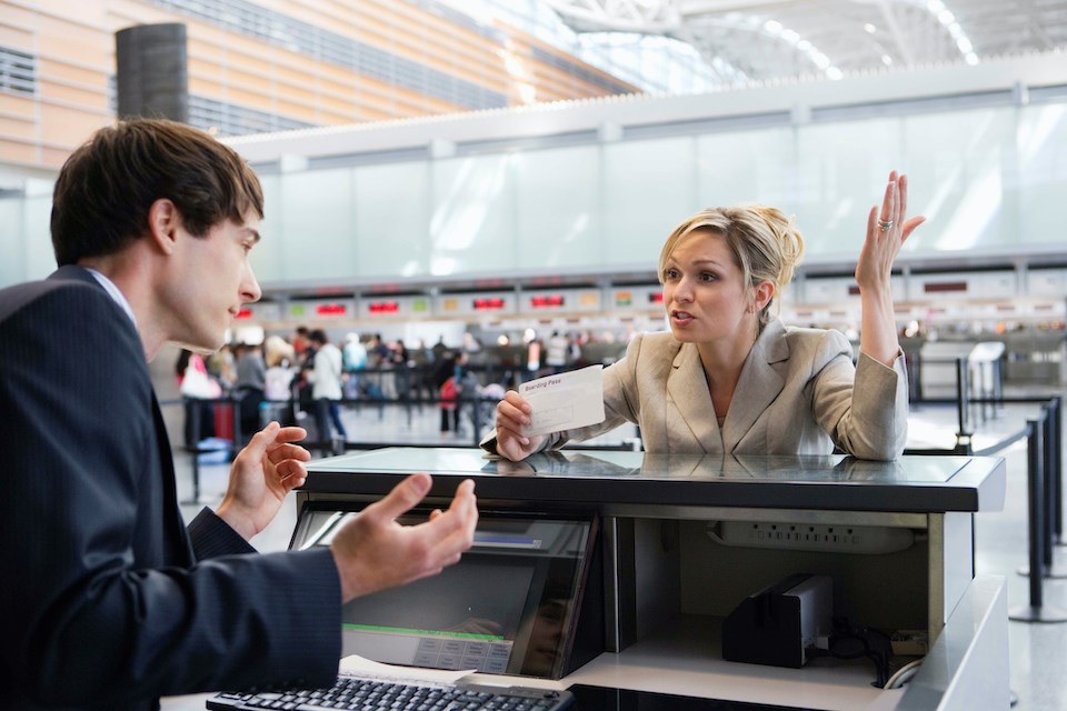 person-buying-a-ticket-at-the-airport