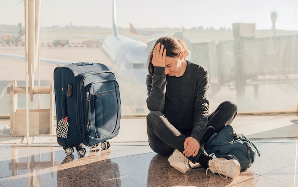 person-looking-sad-at-airport