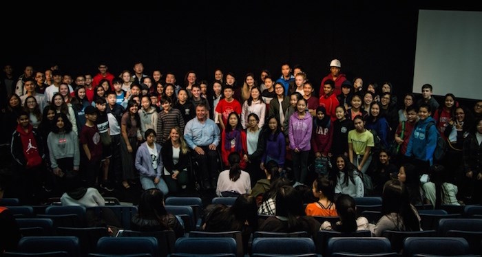  Rick Hansen poses for a photo with students at J.N. Burnett Secondary School. Photo: Cristina Carvalheiro