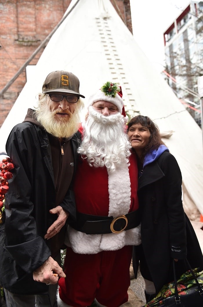  Joe Konkin as Santa Claus, greets visitors at the Downtown Eastside Market. Photo by Dan Toulgoet