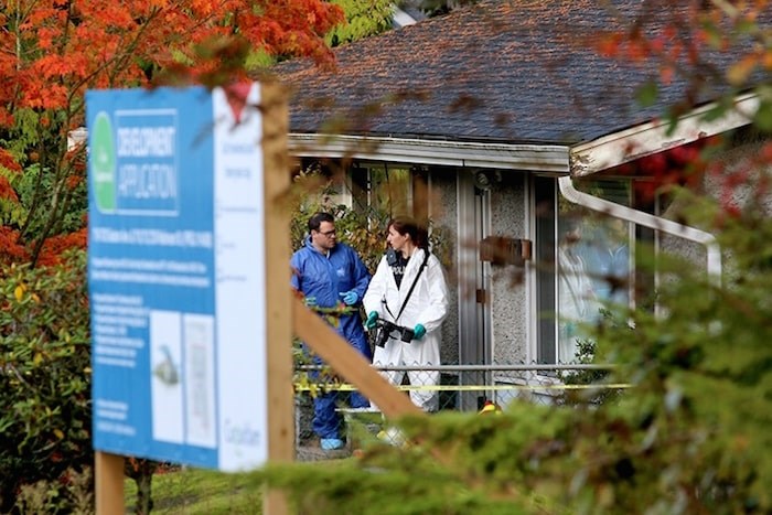  Homicide investigators gather evidence from a home at 719 Seaton Avenue in Coquitlam Wednesday morning. Photo by Mario Bartel/Tri-City News