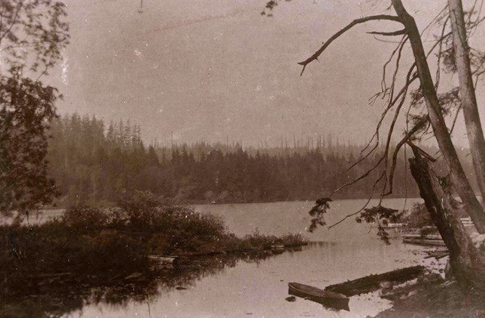  A 1900 photo of Deer Lake included in the Burnaby Village Museum's new Indigenous History in Burnaby Resource Guide shows a shallow dugout Indigenous canoe of the kind once used by Sḵwx̱wú7mesh and hən̓q̓əmin̓əm̓ ancestors to navigate local riverways. City of Burnaby Archives