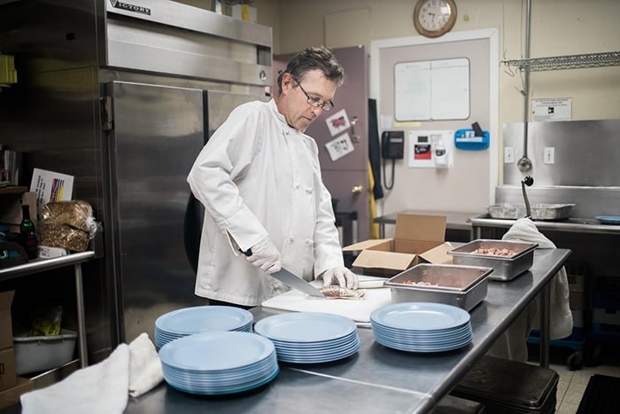  On Saturday, formerly homeless Vancouver chef Mike Miller will be busy in Union Gospel Mission’s kitchen helping to prepare the charity’s annual holiday feast.. Photo: UGM/Andrew Taran