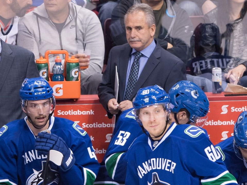 Willie Desjardins behind the Canucks bench