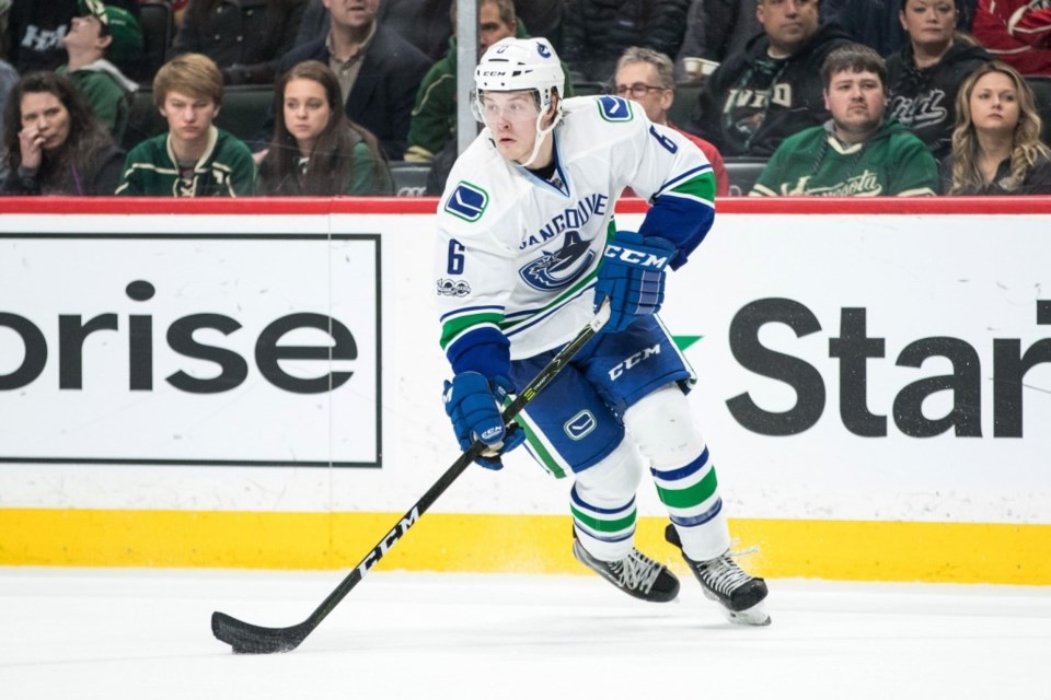 Brock Boeser skates with the puck