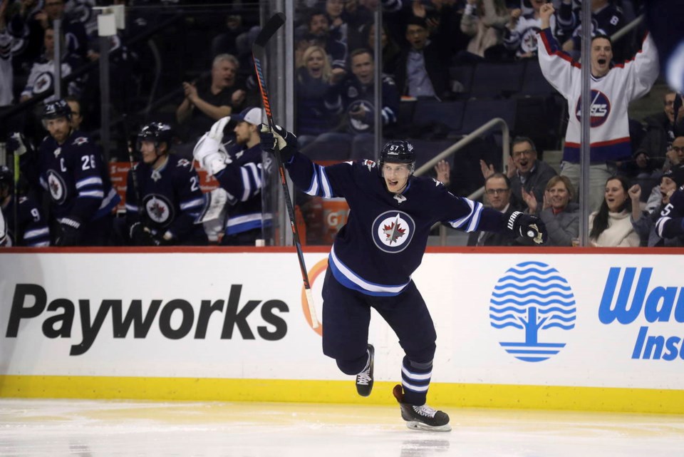 Tyler Myers celebrates a goal with the Winnipeg Jets.