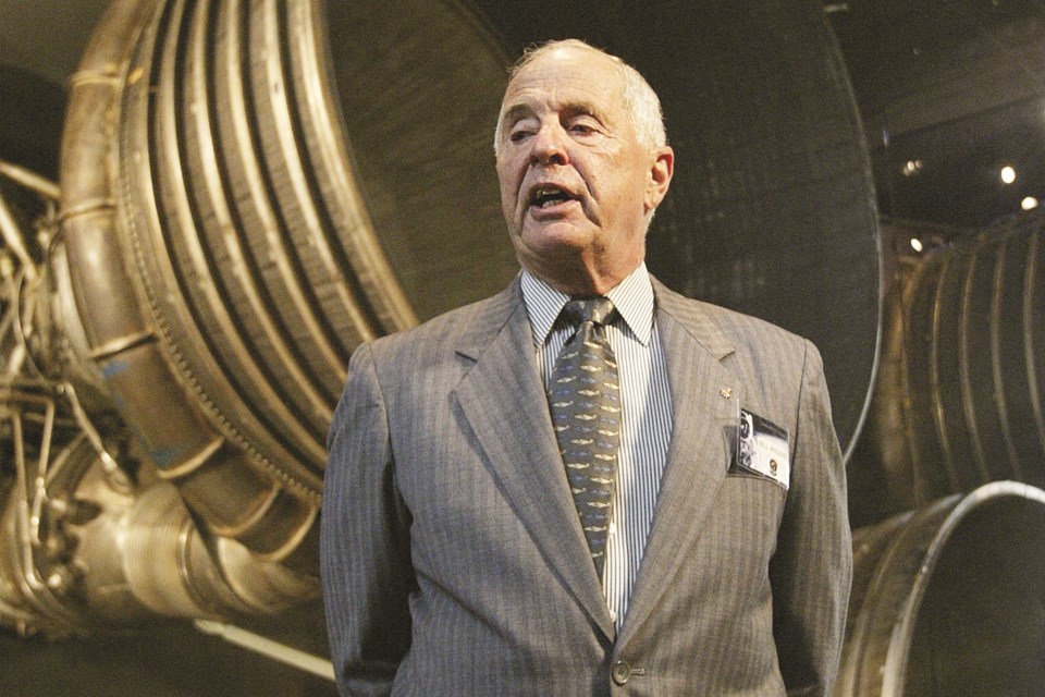 FILE - Apollo 8 Lunar Module Pilot Gen. William Anders, speaks to reporters in front of the Saturn 5 Aft End, the F-1 rocket engines of the first stage of the Apollo 11/Saturn 5 launch vehicle July 20, 2004, in Washington. Retired Maj. Gen. Anders, the former Apollo 8 astronaut who took the iconic “Earthrise” photo showing the planet as a shadowed blue marble from space in 1968, was killed Friday, June 7, 2024, when the plane he was piloting alone plummeted into the waters off the San Juan Islands in Washington state. He was 90. (AP Photo/Manuel Balce Ceneta, File)