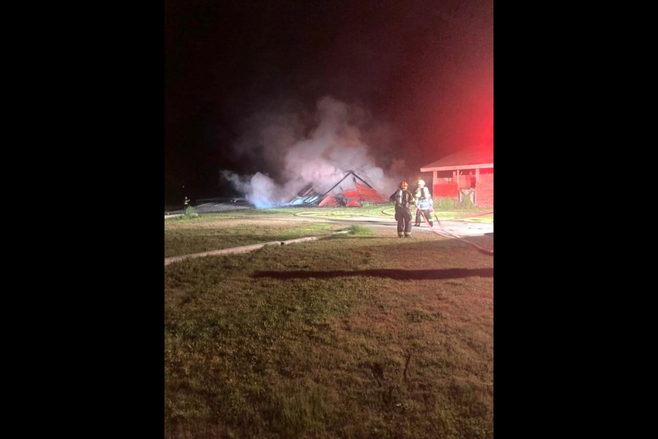 Firefighters in Port Alberni battle a blaze on the city's fairgrounds, where two horse barns were destroyed. Via Port Alberni Fire Department