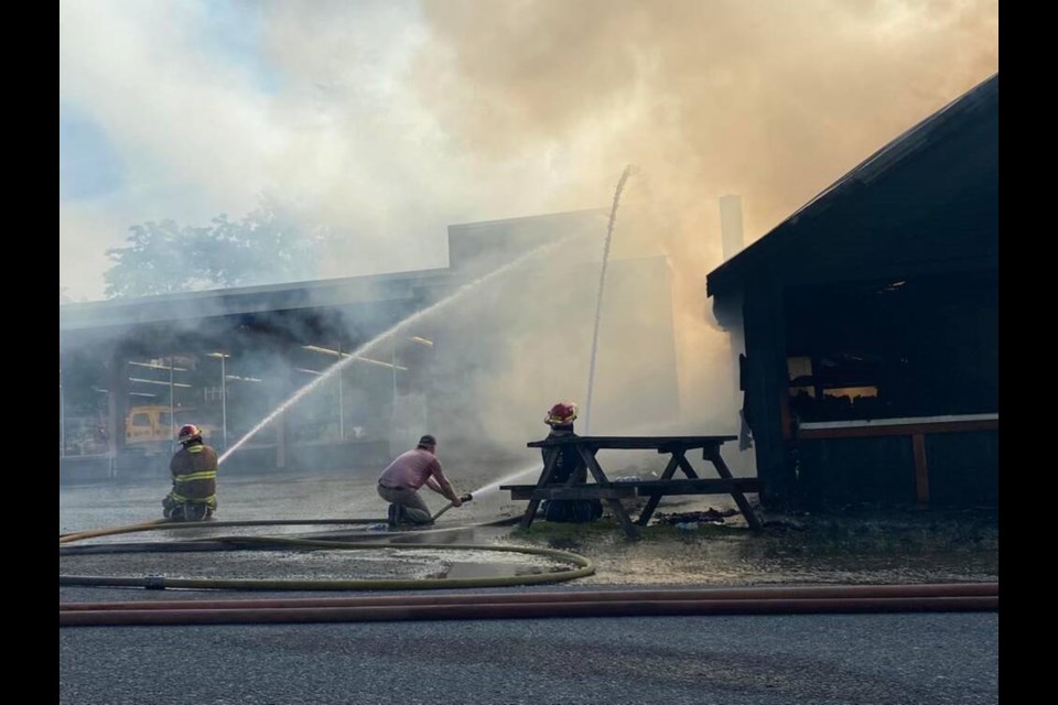 Texada Island volunteer fire departments from Van Anda and Gillies Bay worked to contain a structure fire on Copper Queen Street Friday evening. The crews managed to keep the fire at bay and saved the neighbouring Texada Market, which reopened to the public Sunday. MARK ROBERT 