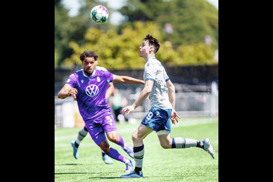 Pacific FC's Abdoulaye Samake, left, and HFX Wanderers' Samuel Salter compete for the ball at Starlight Stadium on Saturday, June 25, 2022. DARREN STONE, TIMES COLONIST 