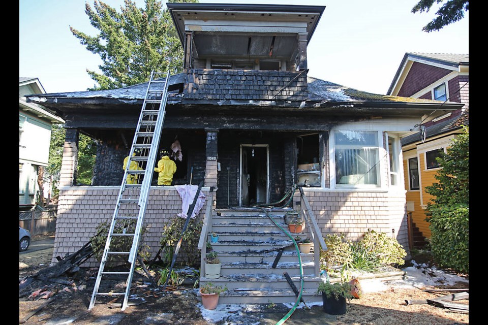 Fire officials investigate the scene of a morning fire at 1040 Princess Ave. on Thursday, Sept. 1, 2022. ADRIAN LAM, TIMES COLONIST 