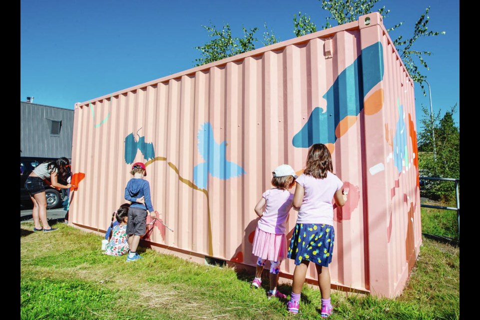 Day-camp participants help paint a mural on the Cedar Hill Recreation and Arts Centre's Emergency Social Services storage container on Tuesday, Sept. 30, 2022. . The District of Saanich mural project aims to integrate public art into Saanich neighbourhoods and public spaces. DARREN STONE, TIMES COLONIST 