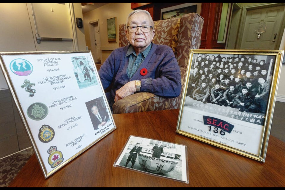 Gordie Quan with some of his wartime memorabilia at Ross Place Seniors Community. DARREN STONE, TIMES COLONIST 