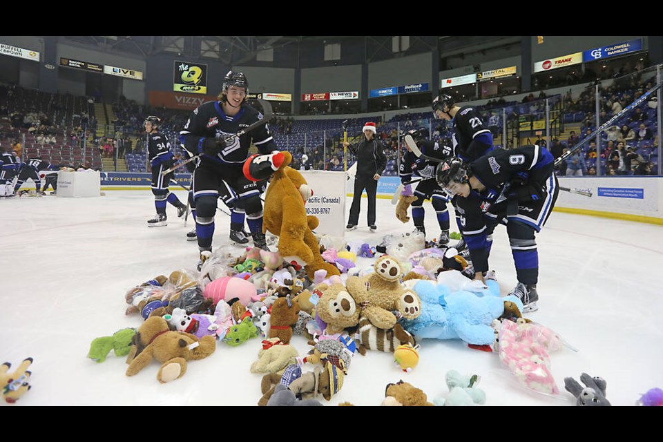 Victoria Royals players pick up teddy bears after they were thrown onto the ice following what was thought to be the Royals’ first goal on Teddy Bear Toss night at Save-on-Foods Memorial Centre on Friday, Dec. 16, 2022, during the game against the Tri-CIty Americans. The goal was ultimately ruled out but the toys will still be donated to charity. ADRIAN LAM, TIMES COLONIST