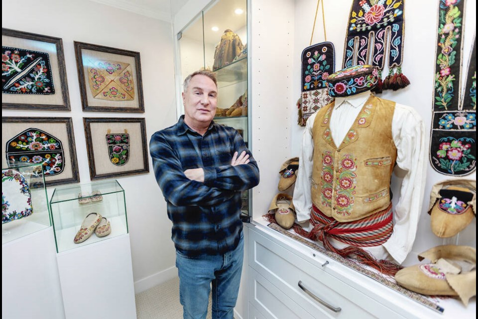 Métis poet Gregory Scofield with some of his collection of beaded cultural artifacts. DARREN STONE, TIMES COLONIST 