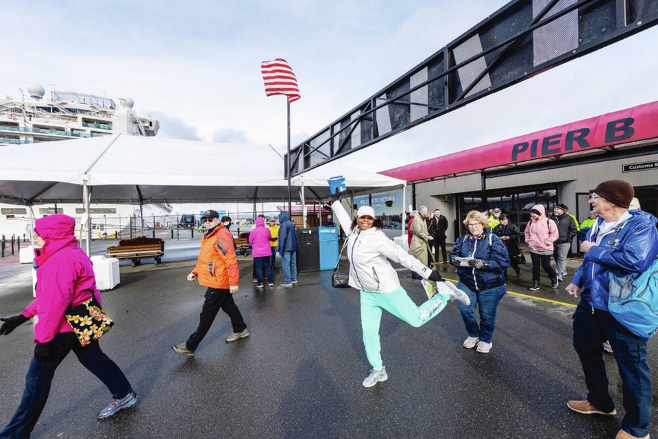 Passengers from the Sapphire Princess, the first cruise ship of the season to dock at Ogden Point, arrive on-shore on Tuesday. DARREN STONE, TIMES COLONIST 