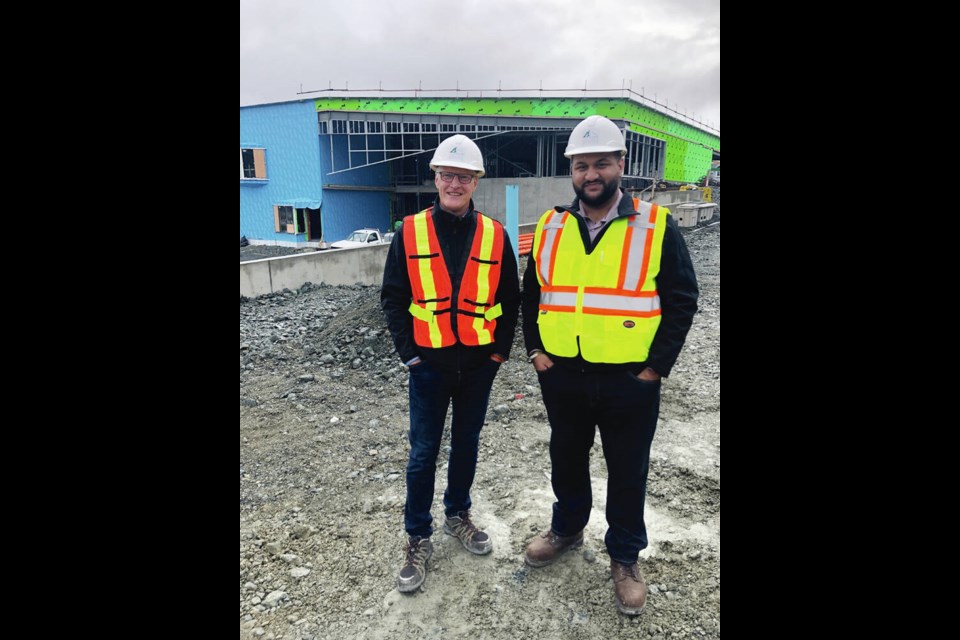 Sooke School District superintendent Scott Stinson, left, with then board chair Ravi Parmar, inspects the site of two new schools in the Westhills area in 2021. TIMES COLONIST 