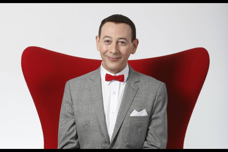 FILE - Actor Paul Reubens portraying Pee-wee Herman poses for a portrait while promoting "The Pee-wee Herman Show" live stage play, Monday, Dec. 7, 2009, in Los Angeles. Reubens died Sunday night after a six-year struggle with cancer that he did not make public, his publicist said in a statement. (AP Photo/Danny Moloshok, File)