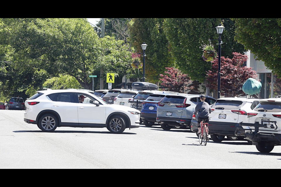 A cyclist rides on Estevan Avenue toward Estevan Village. A Haultain-Estevan bikeway would run from an existing route on Haultain/Kings to the north side of Willows Beach. ADRIAN LAM, TIMES COLONIST 