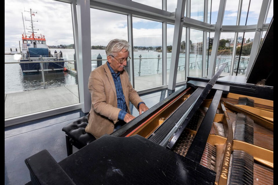  Christopher Donison, artistic director of the Music By the Sea Festival, prepares for the Aug. 1-5 event at the Victoria International Marina.  DARREN STONE, TIMES COLONIST